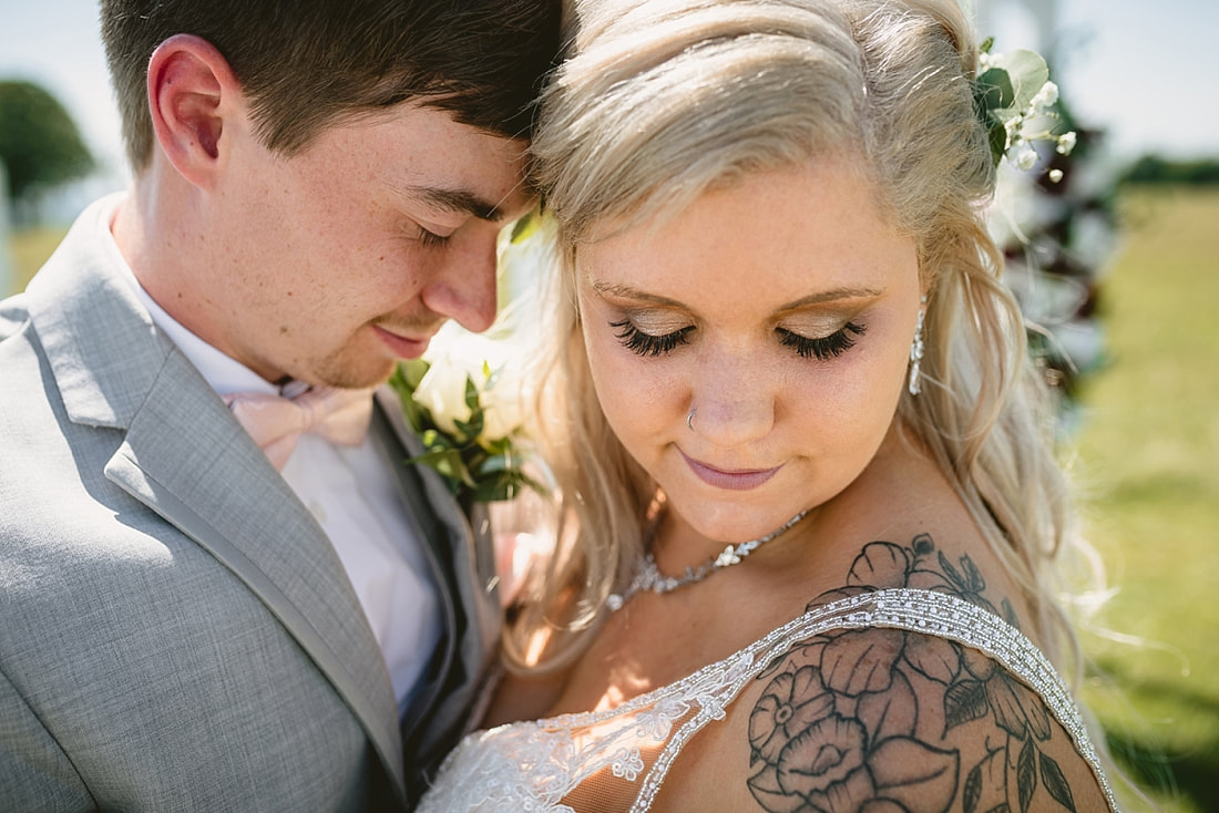 bride and groom wedding photos on love mountain at the wedding barn in arkansas