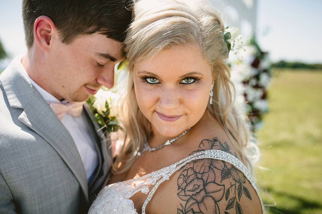 bride and groom wedding photos on love mountain at the wedding barn in arkansas