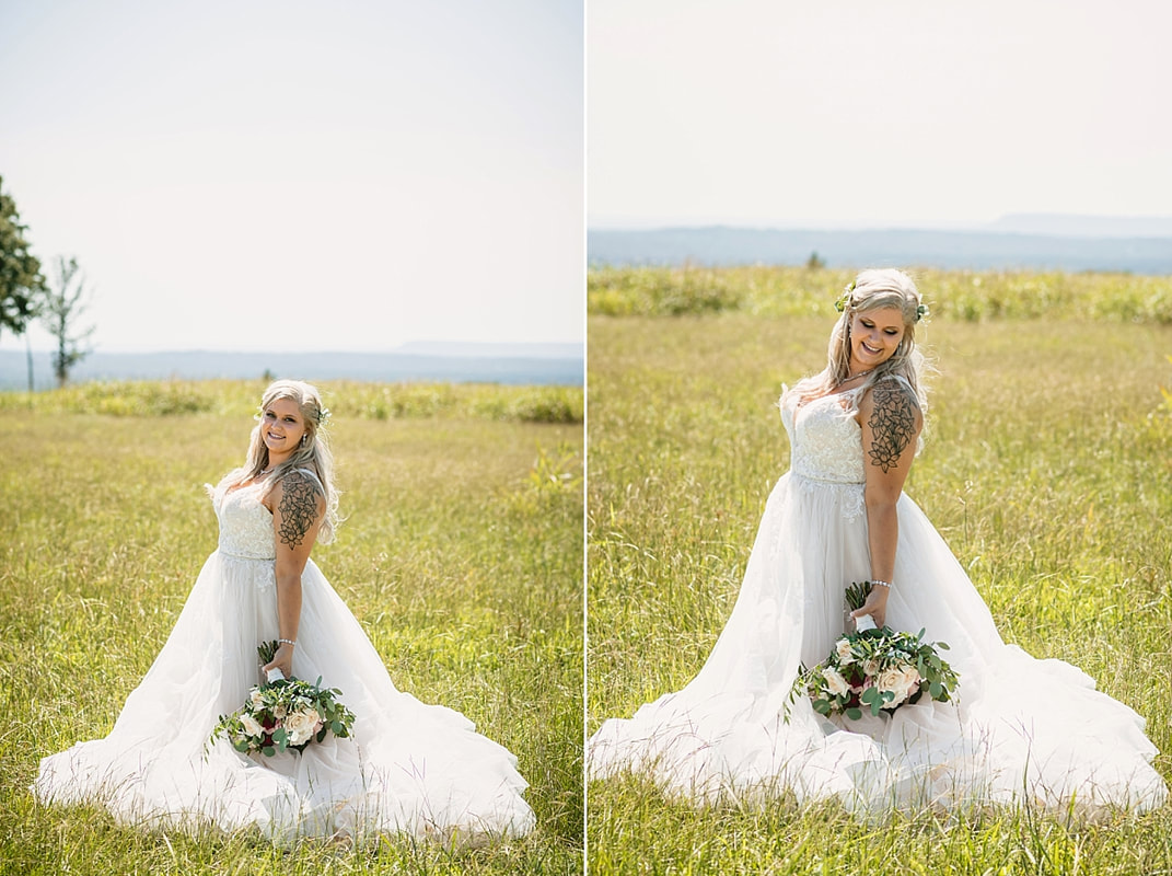bride and groom wedding photos on love mountain at the wedding barn in arkansas