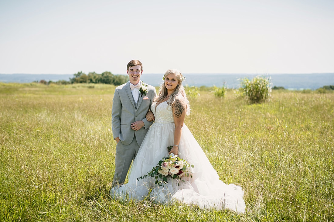 bride and groom wedding photos on love mountain at the wedding barn in arkansas