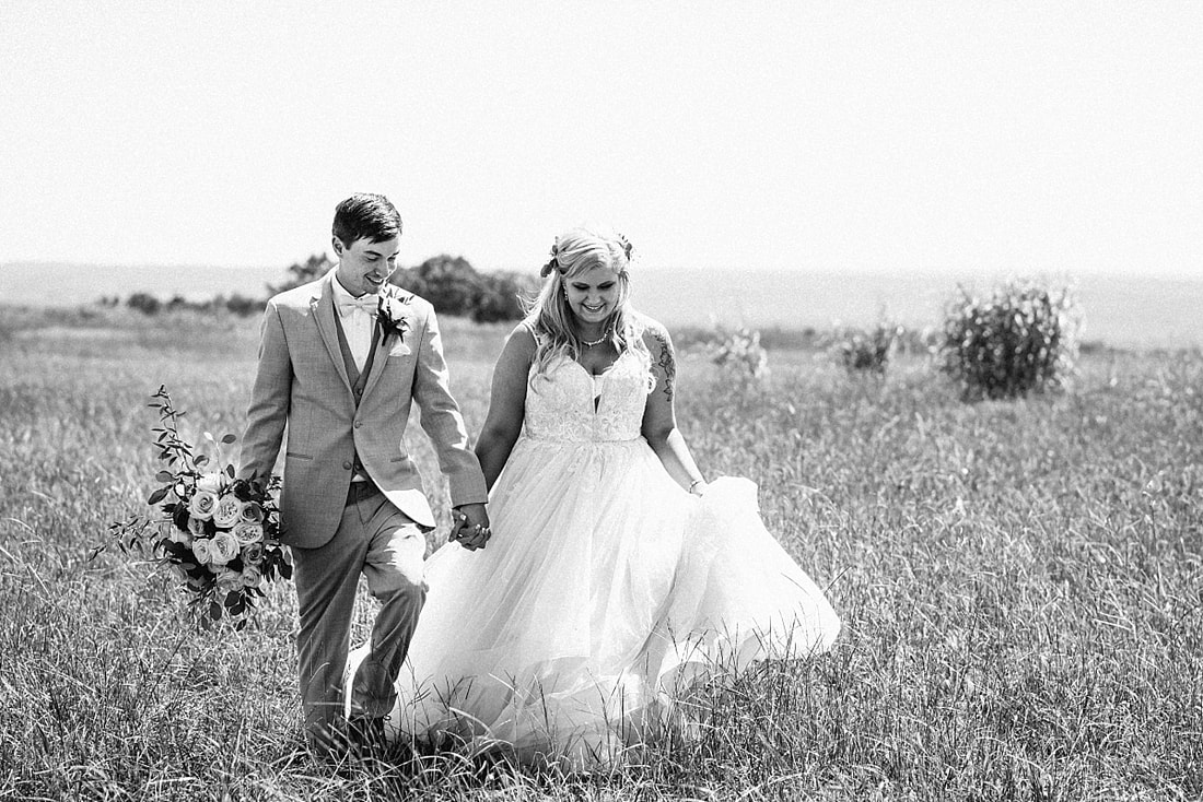 bride and groom wedding photos on love mountain at the wedding barn in arkansas
