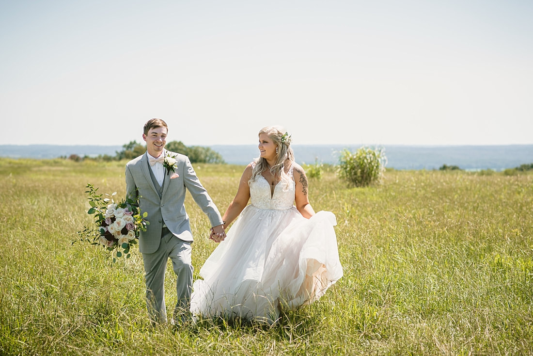 bride and groom wedding photos on love mountain at the wedding barn in arkansas