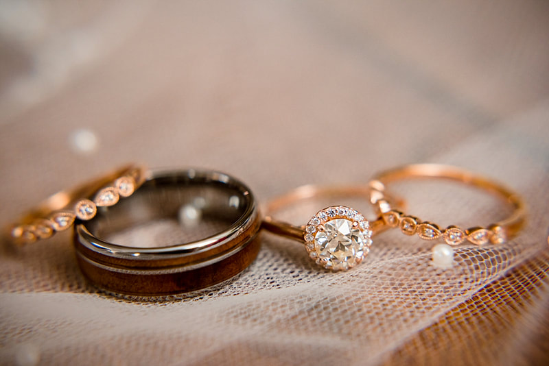 Close up of Wedding rings on wedding veil at Avon Acres