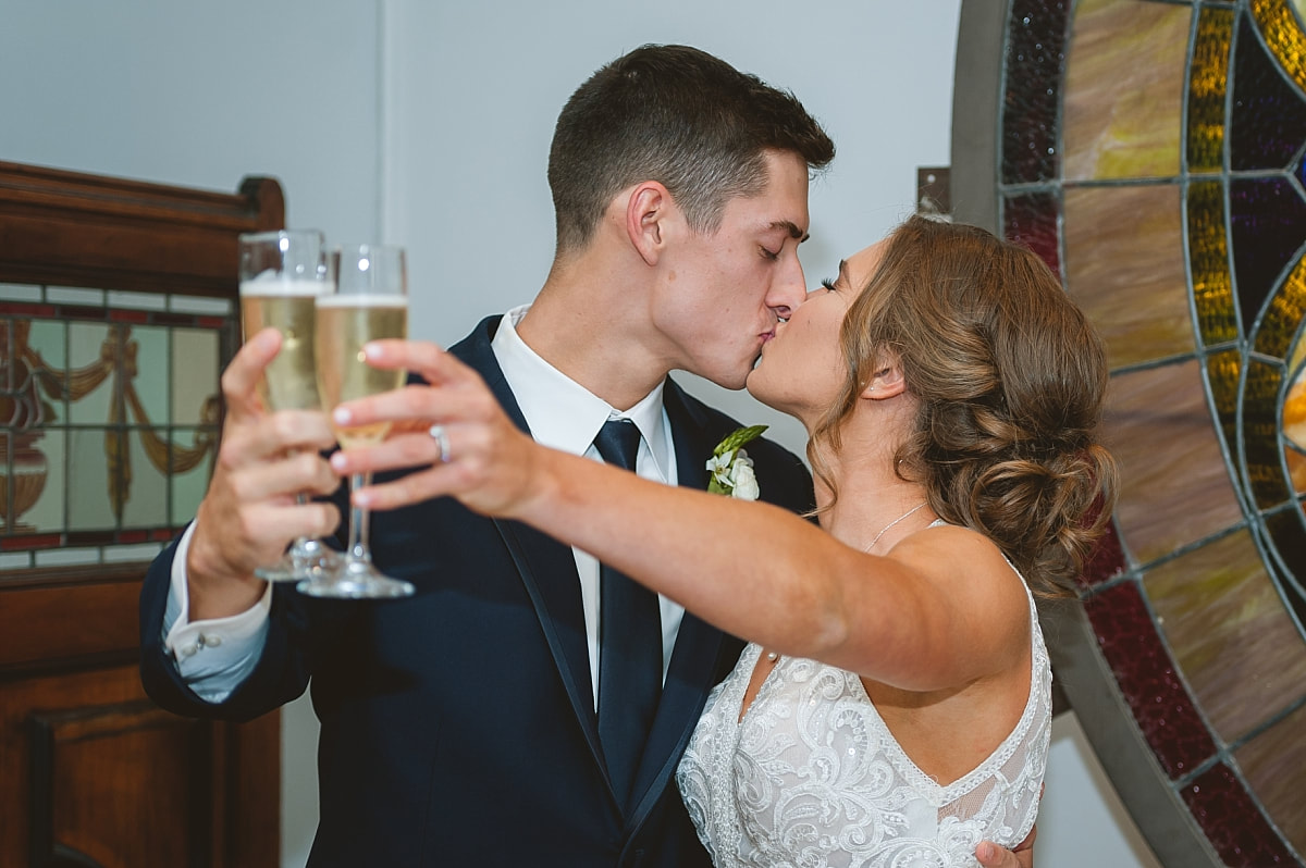 bride and groom toasting at the robinson gallery downtown memphis