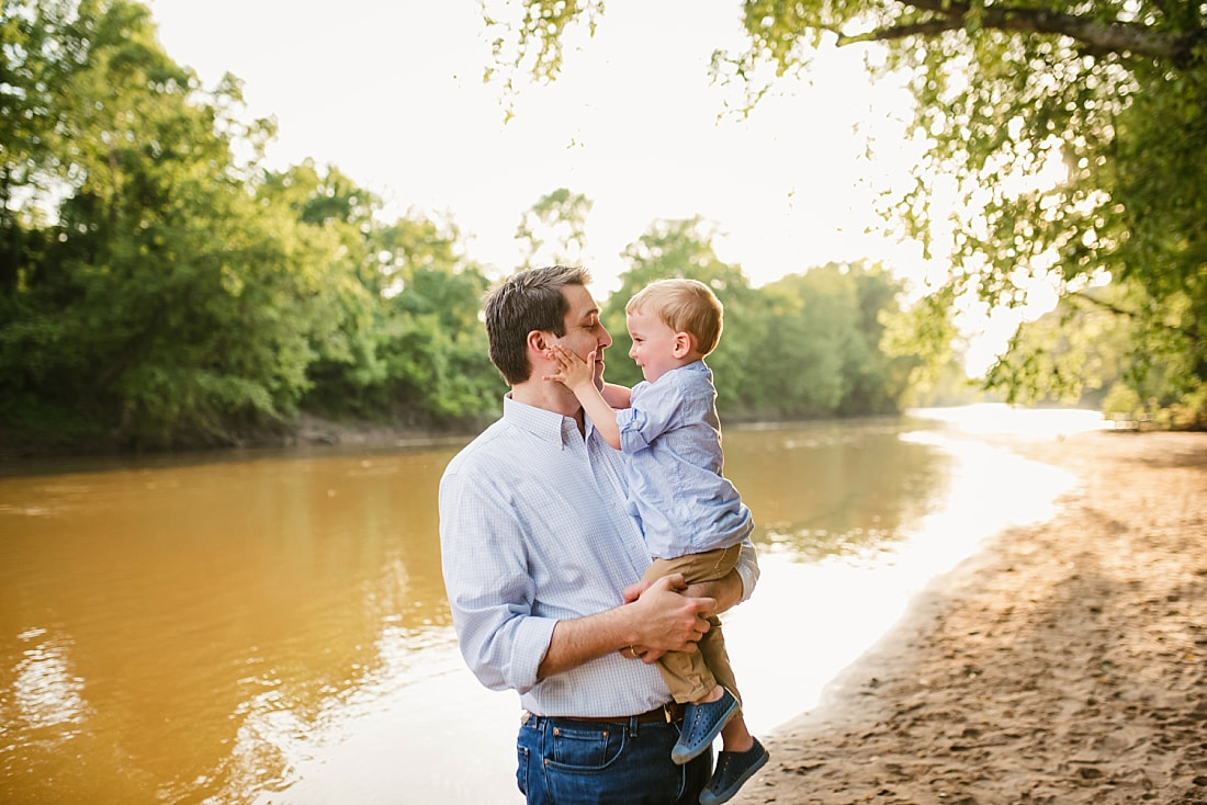 dad playing with son at the Wolf River in Memphis, TN