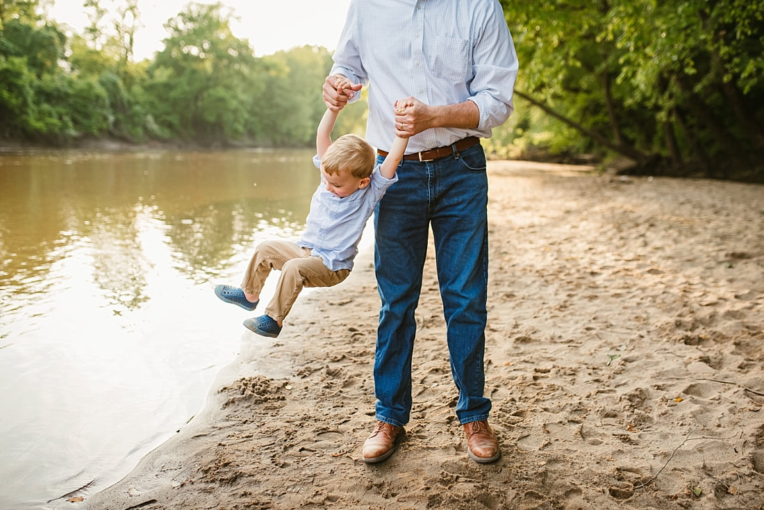 dad playing with son at the Wolf River in Memphis, TN