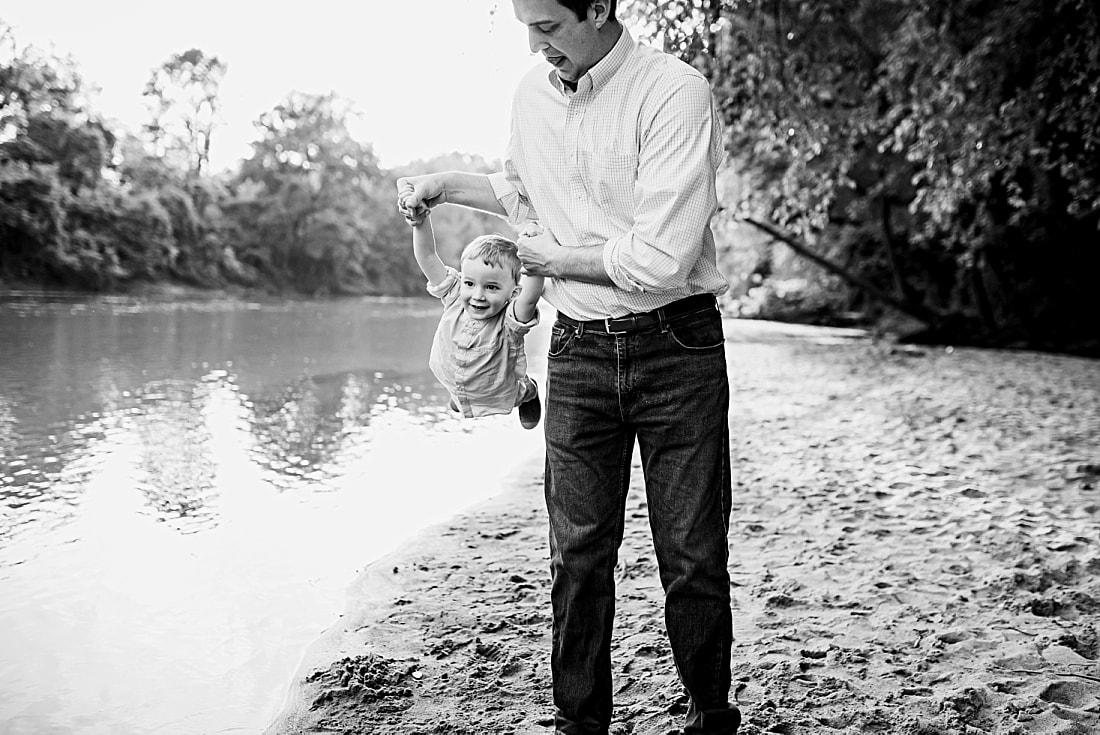dad playing with son at the Wolf River in Memphis, TN