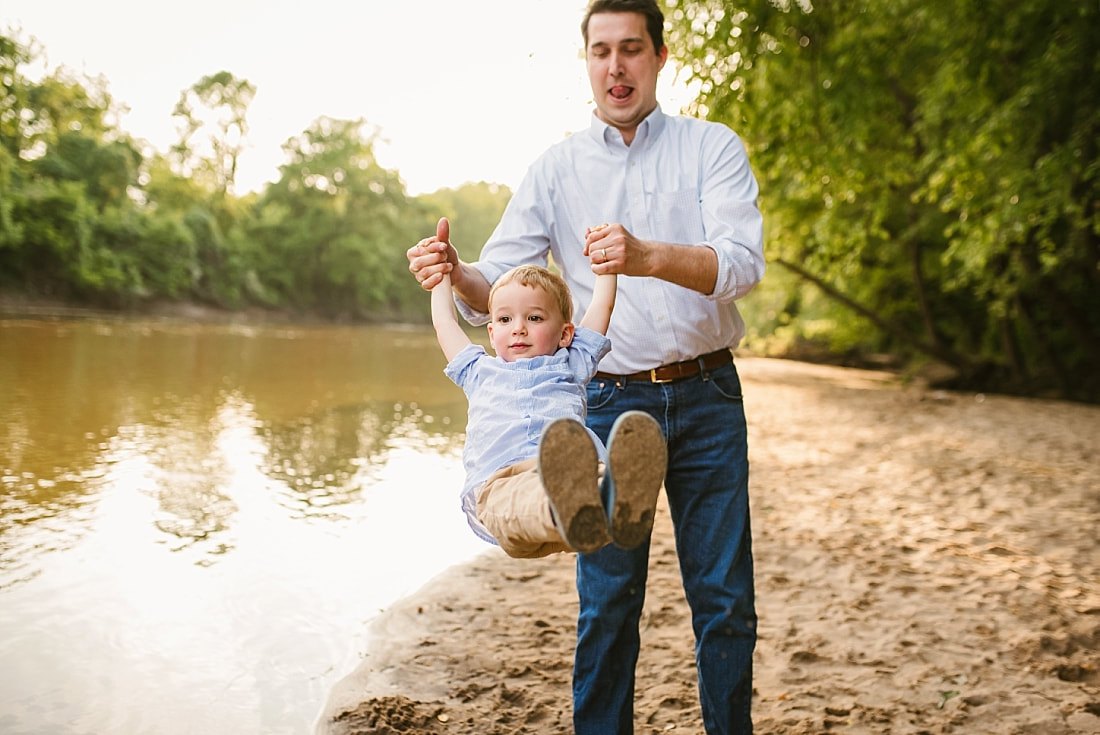 dad playing with son at the Wolf River in Memphis, TN