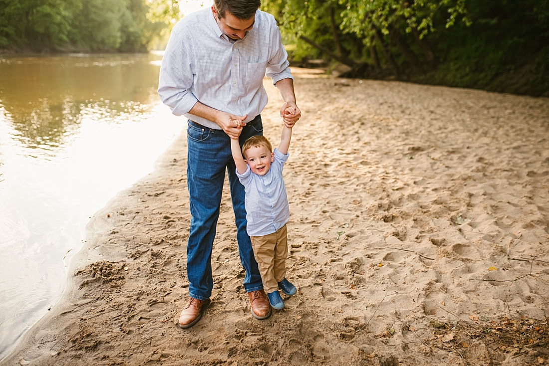 dad playing with son at the Wolf River in Memphis, TN