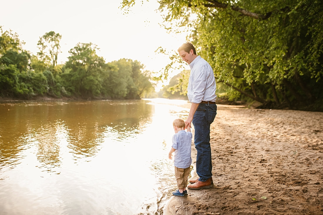 dad playing with son at the Wolf River in Memphis, TN