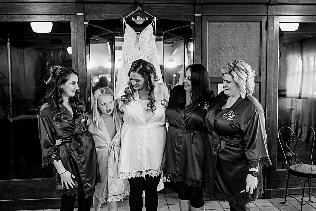 bride with her bridesmaids in their matching robes at green frog farm