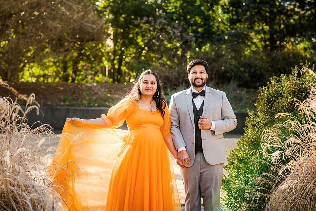 well dress couple for maternity photos at memphis botanic garden