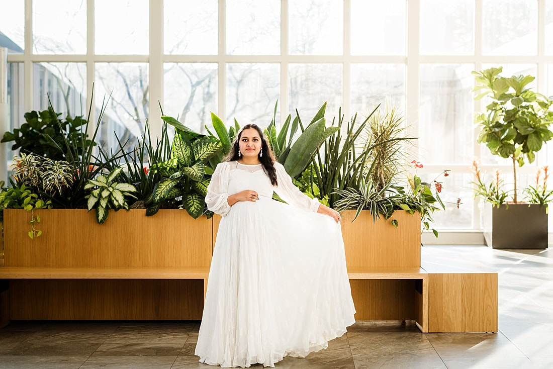 maternity portrait of mother wearing white indian dress at memphis botanic garden