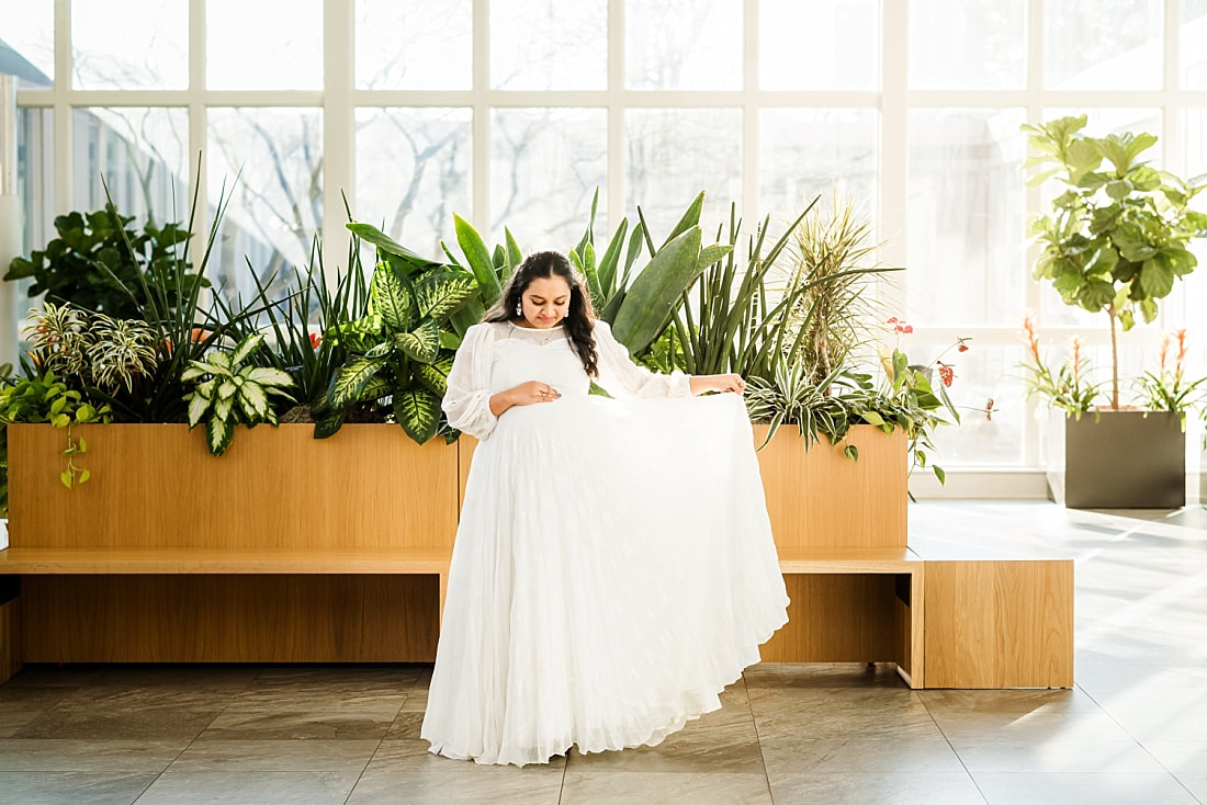 maternity portrait of mother wearing white indian dress at memphis botanic garden