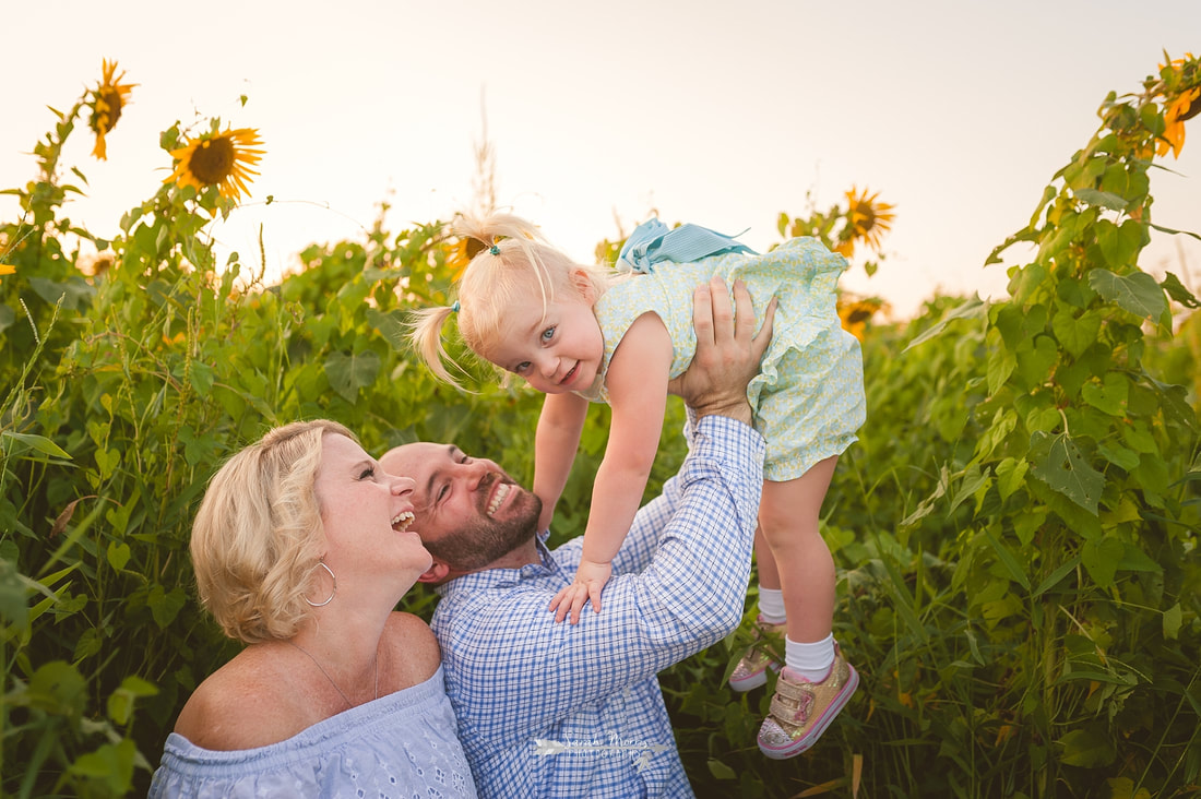 family photos in sunflower field at the agricenter, memphis, tn