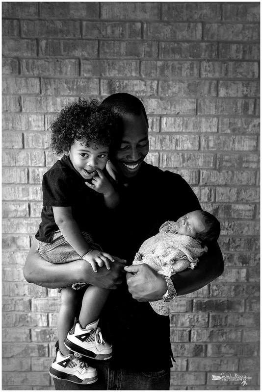 newborn photos of baby girl with daddy and sibling 