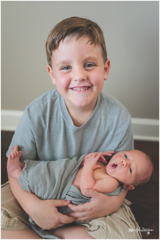 Newborn photos with older siblings