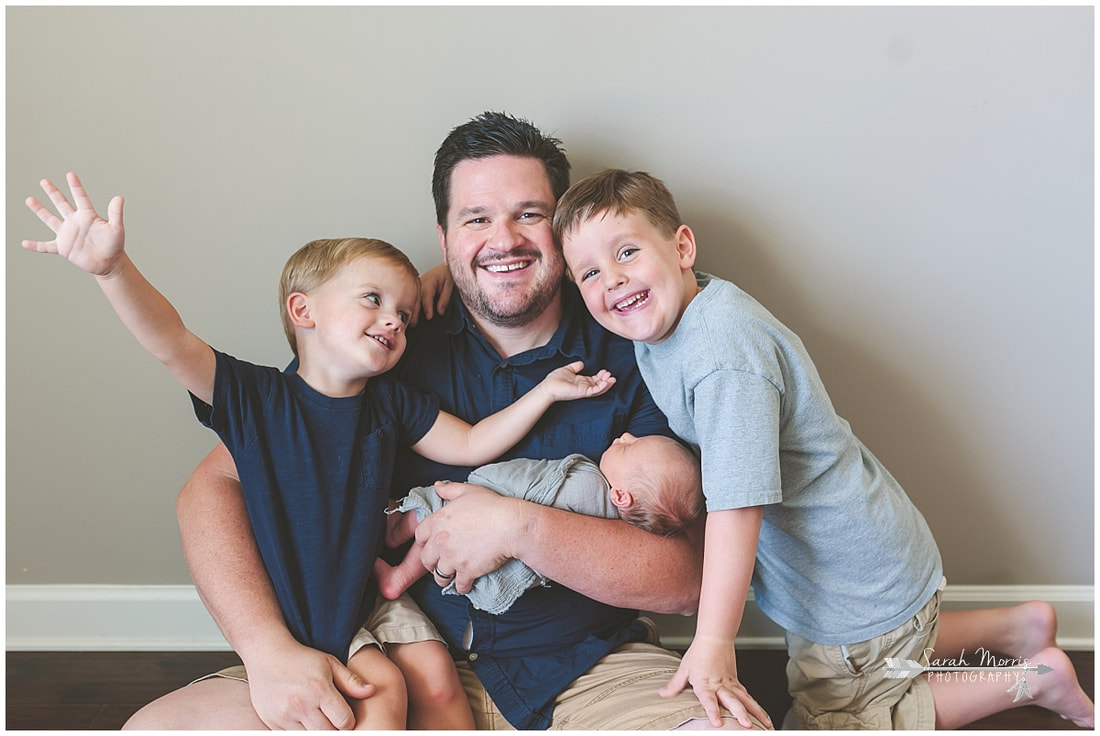 Newborn photos with dad and older siblings