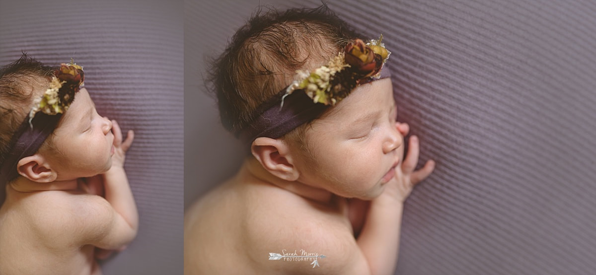 newborn baby girl sleeping on a purple blanket, wearing a purple flower crown