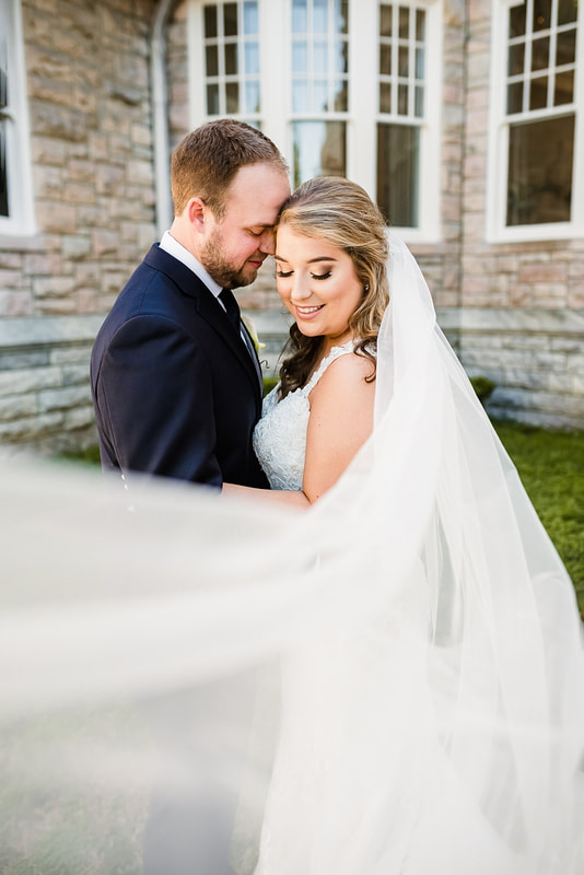 Bride and Groom snuggling during Wedding Portraits at the Pink Palace, Wedding Photographer Memphis, TN