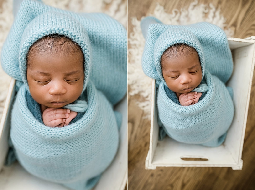 newborn baby wrapped in blue in wooden box for newborn session in Memphis, TN