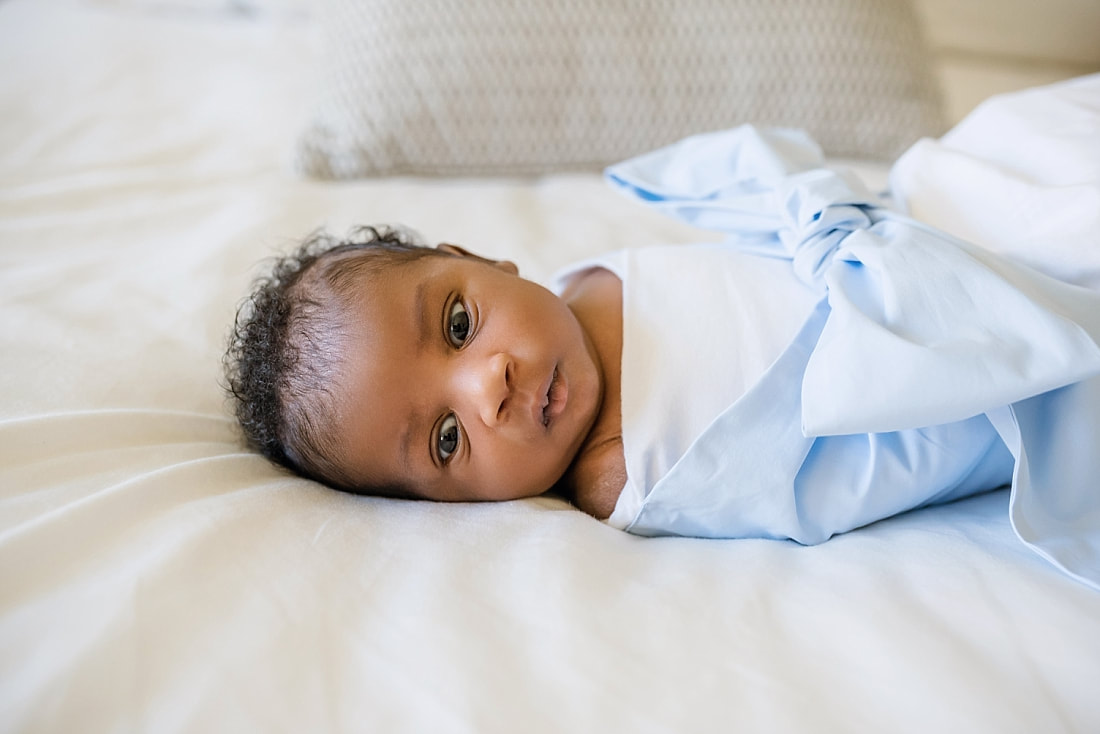 Baby boy wrapped in a Bow Swaddle by The Beaufort Bonnet Company for newborn photos in Collierville, TN