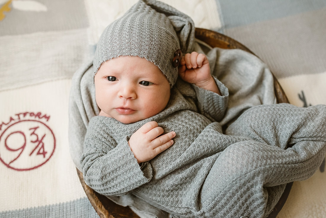 newborn on Harry Potter blanket for newborn photos in Memphis, TN