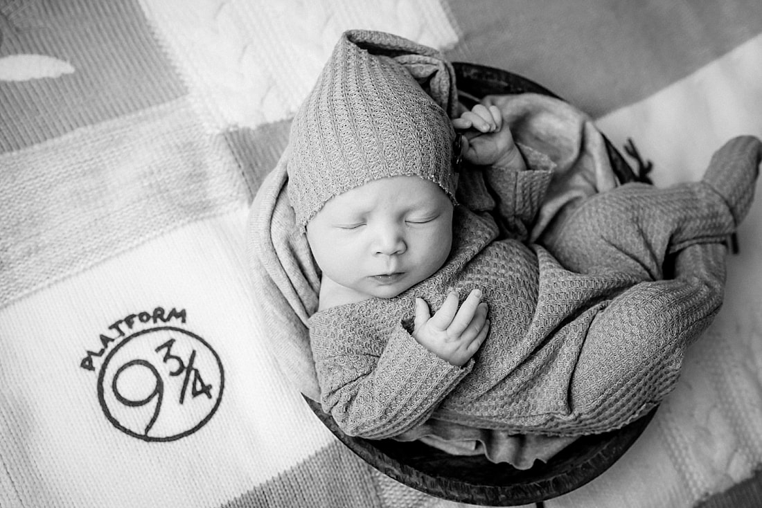 newborn on Harry Potter blanket for newborn photos in Memphis, TN