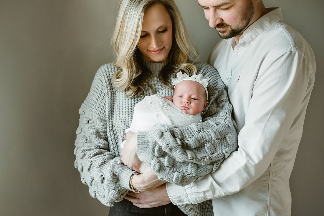 parents with newborn baby girl for newborn portraits in Memphis, TN
