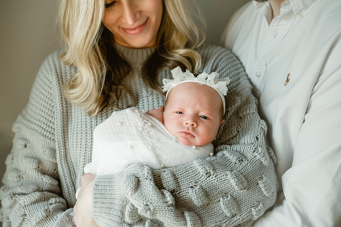 parents with newborn baby girl for newborn portraits in Memphis, TN