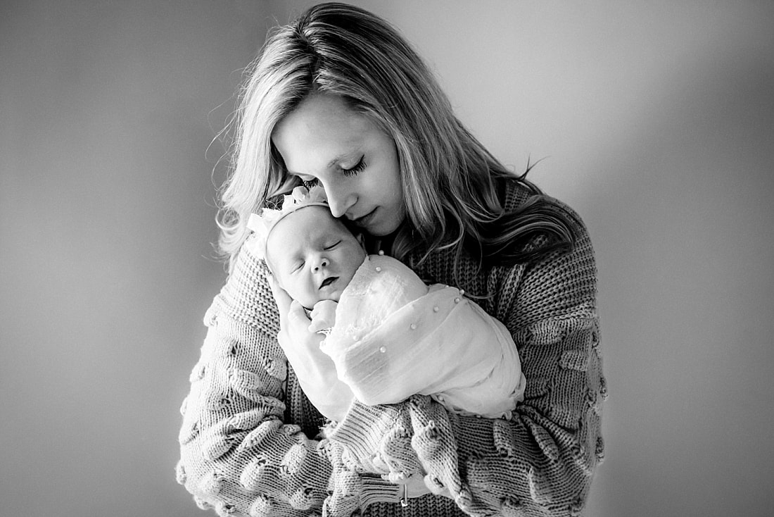 parents with newborn baby girl for newborn portraits in Memphis, TN