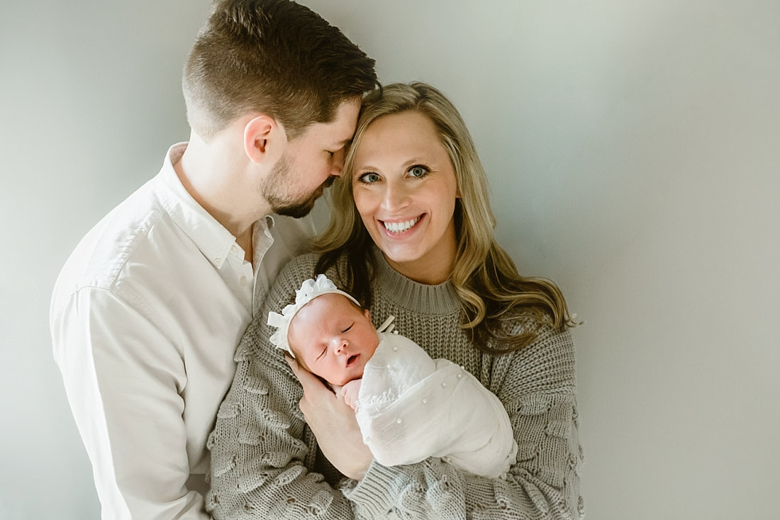 parents with newborn baby girl for newborn portraits in Memphis, TN