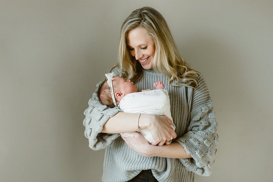 parents with newborn baby girl for newborn portraits in Memphis, TN
