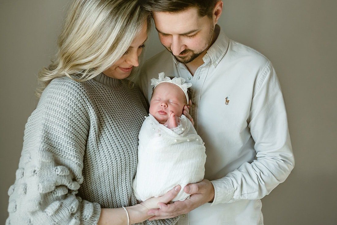 parents with newborn baby girl for newborn portraits in Memphis, TN