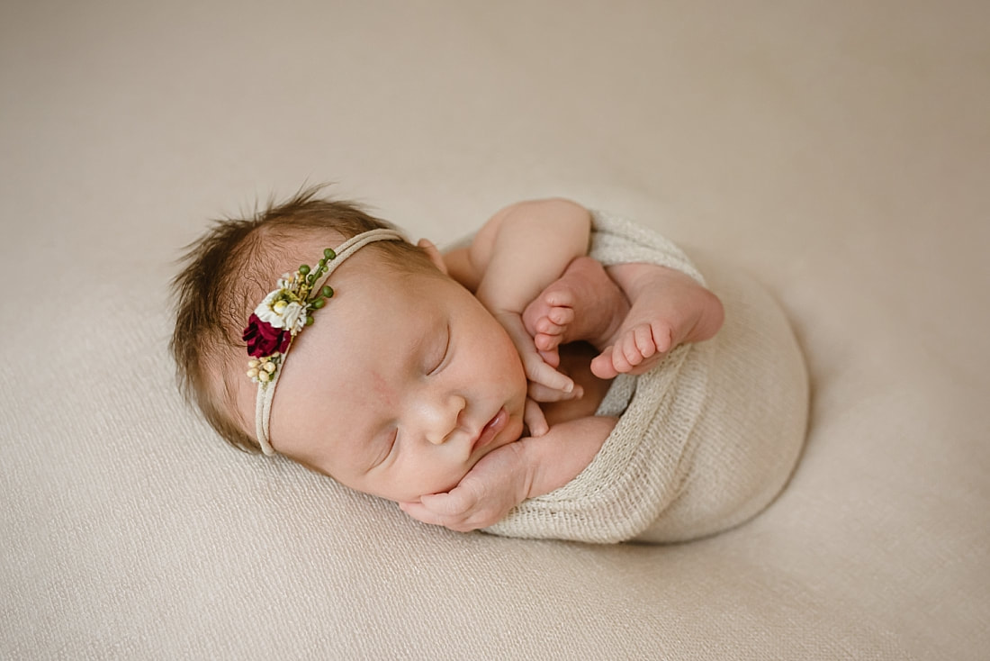 Baby girl swaddled for newborn photoshoot in Memphis, TN