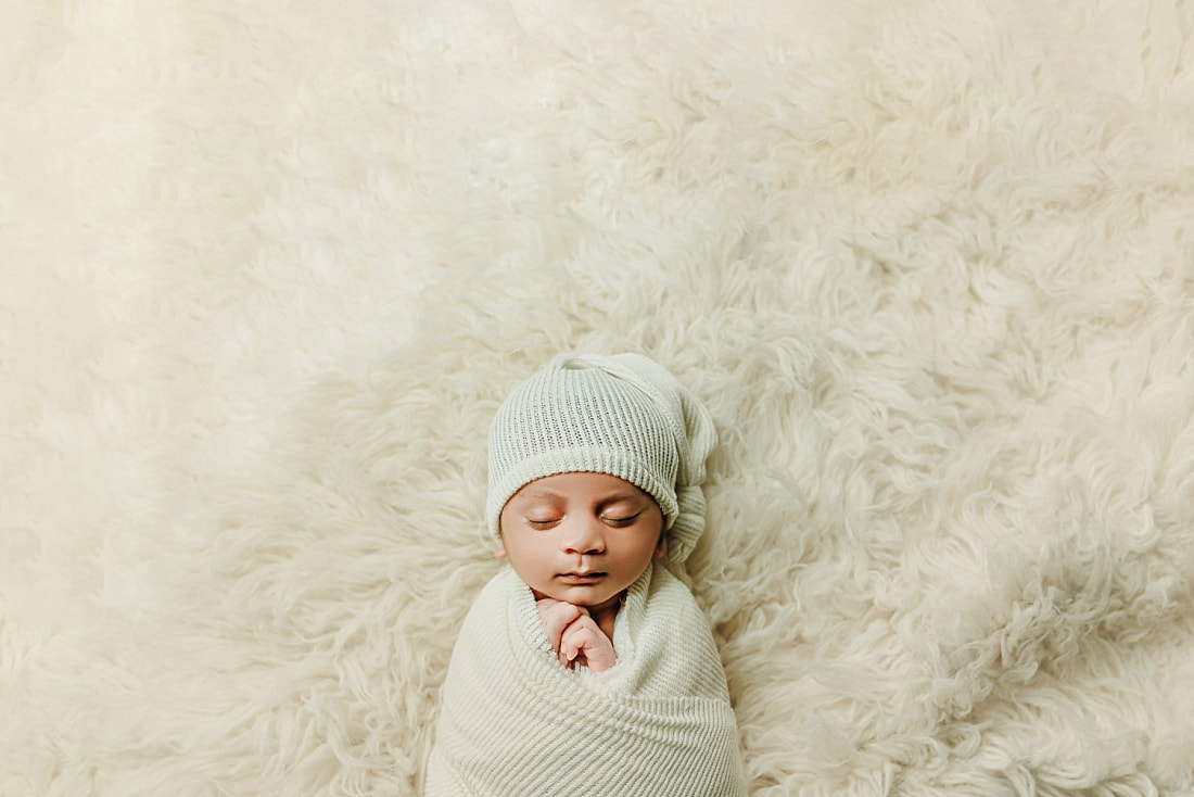 Newborn baby boy swaddled for newborn portrait in Memphis, TN