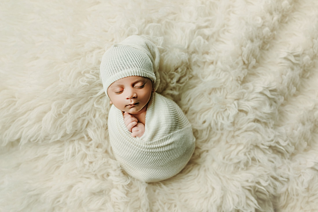 Newborn baby boy swaddled for newborn portrait in Memphis, TN