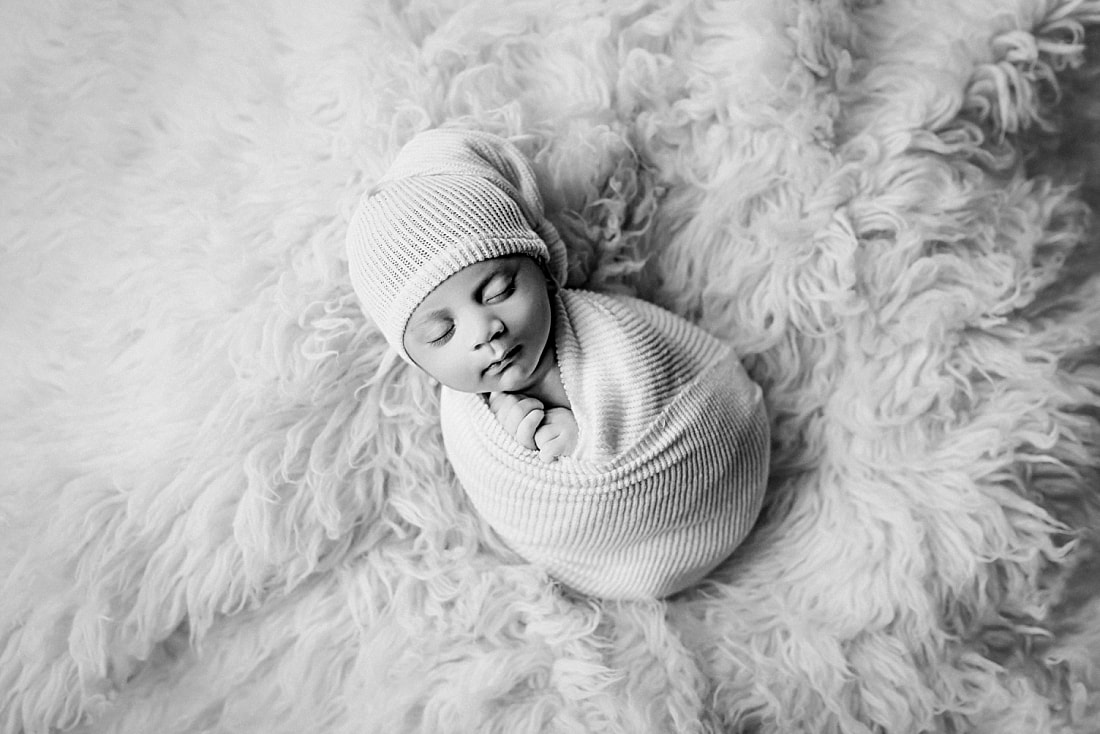Newborn baby boy swaddled for newborn portrait in Memphis, TN