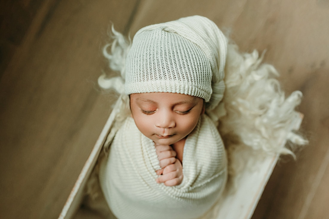 Newborn baby boy swaddled for newborn portrait in Memphis, TN