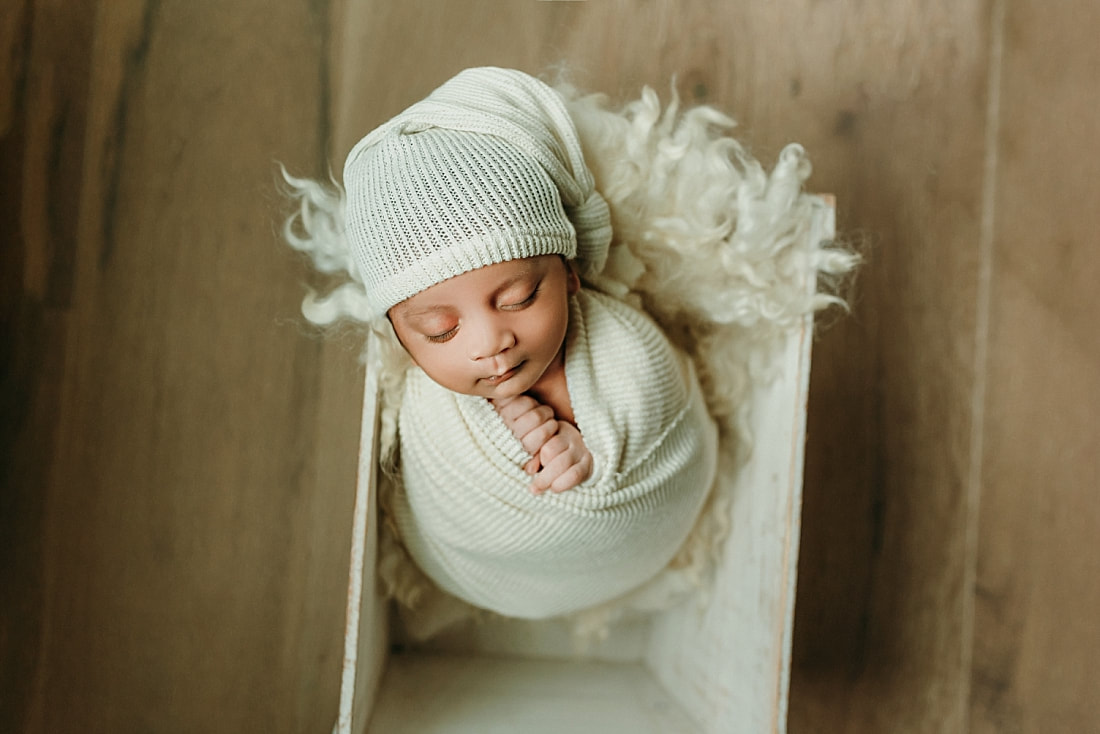 Newborn baby boy swaddled for newborn portrait in Memphis, TN