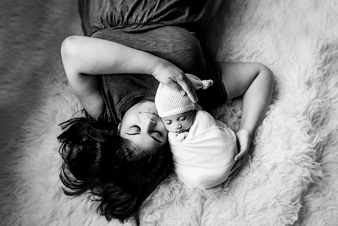 Newborn baby boy swaddled with mom for newborn portrait in Memphis, TN