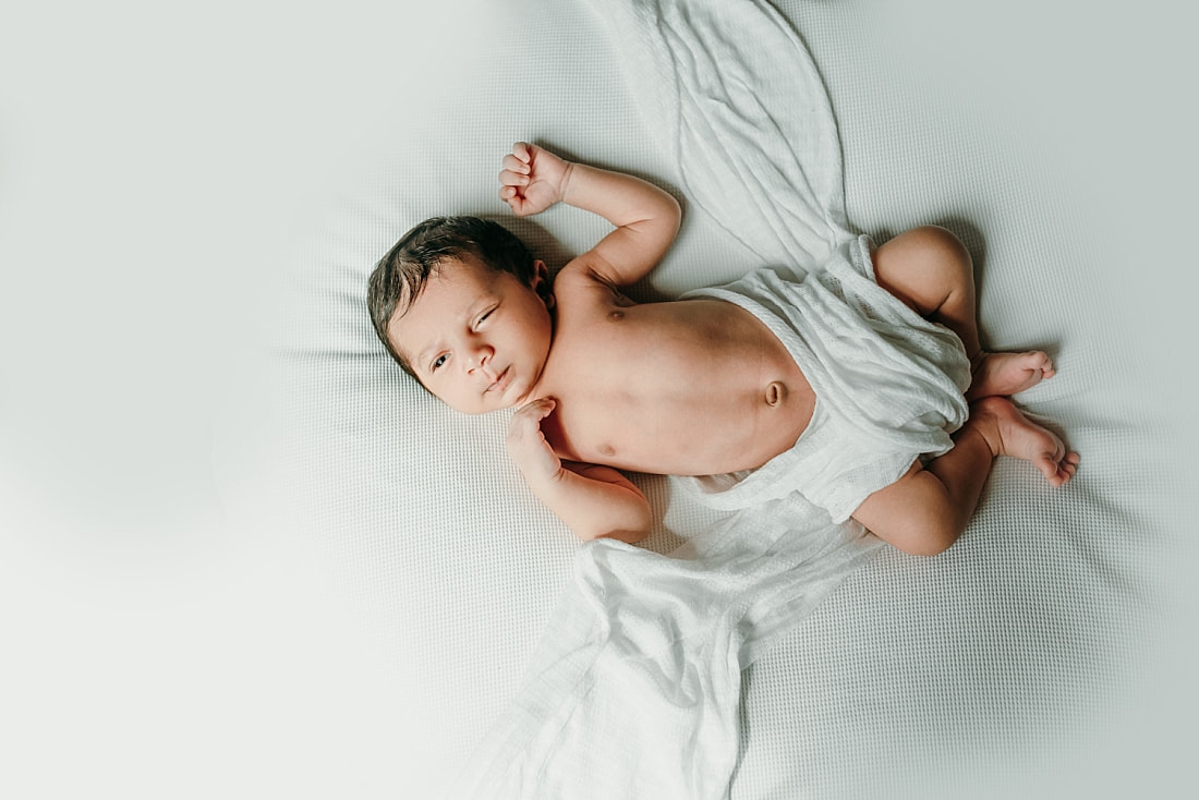 baby boy awake on white blanket in memphis, tn