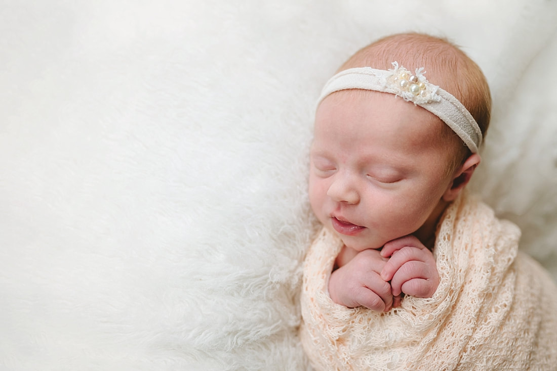newborn baby swaddled for newborn photoshoot in Memphis, TN
