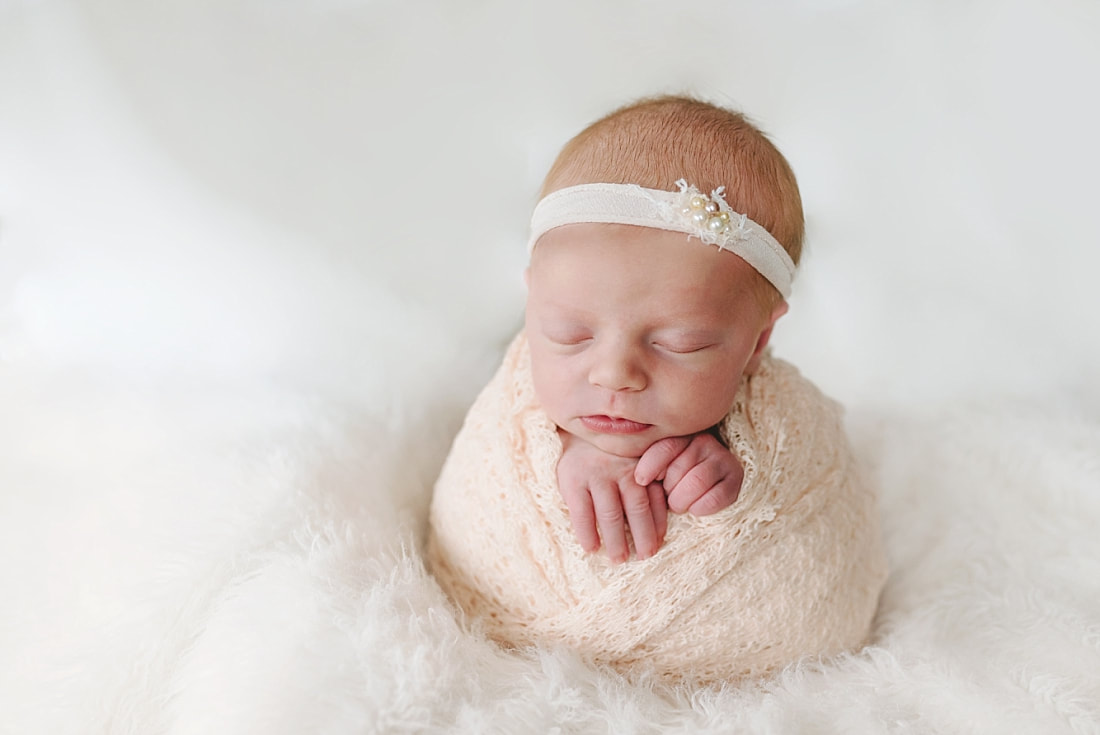newborn baby swaddled for newborn photoshoot in Memphis, TN