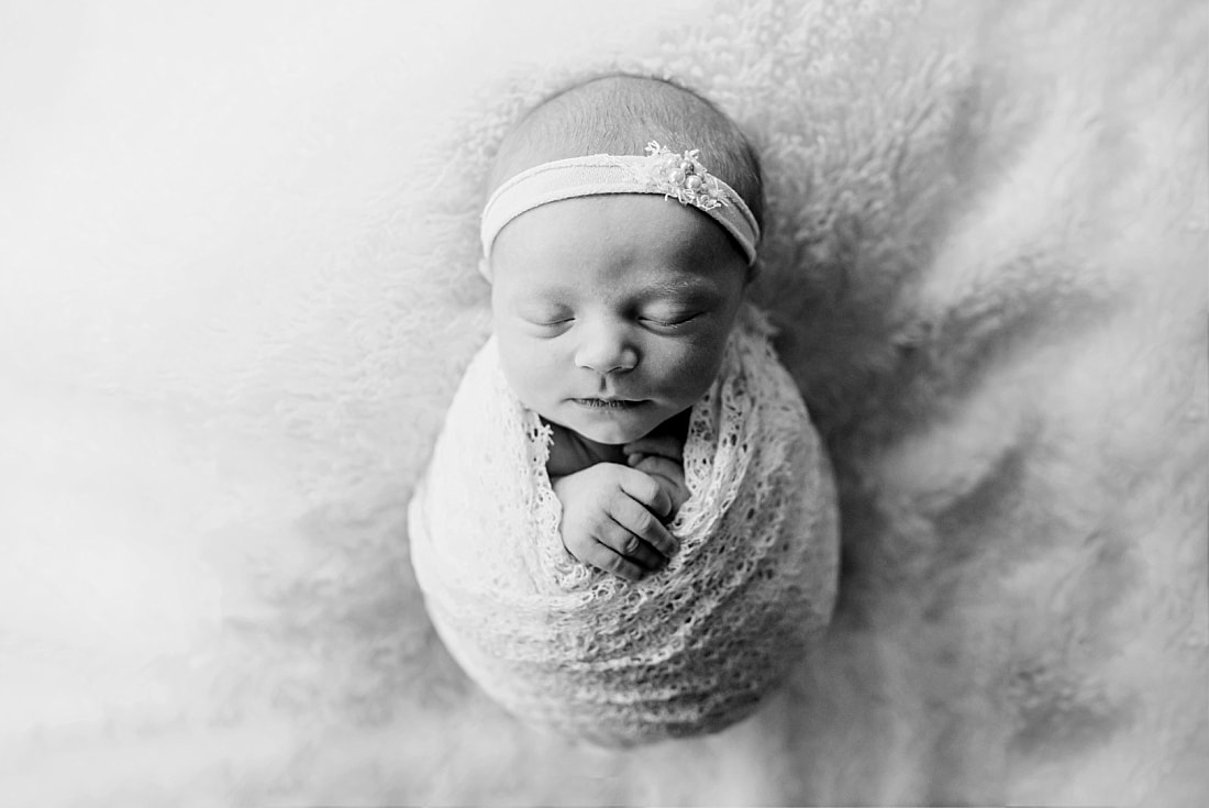 newborn baby swaddled for newborn photoshoot in Memphis, TN