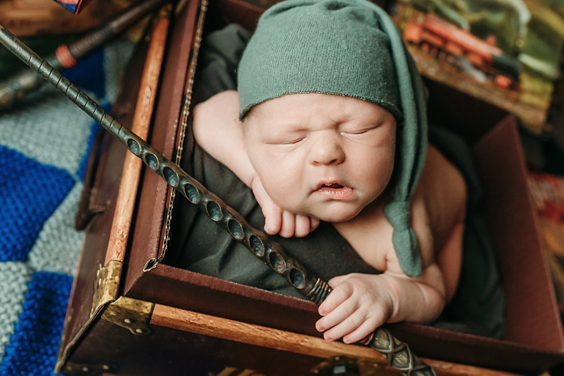 newborn baby boy posed in a Harry Potter scene in Memphis, TN