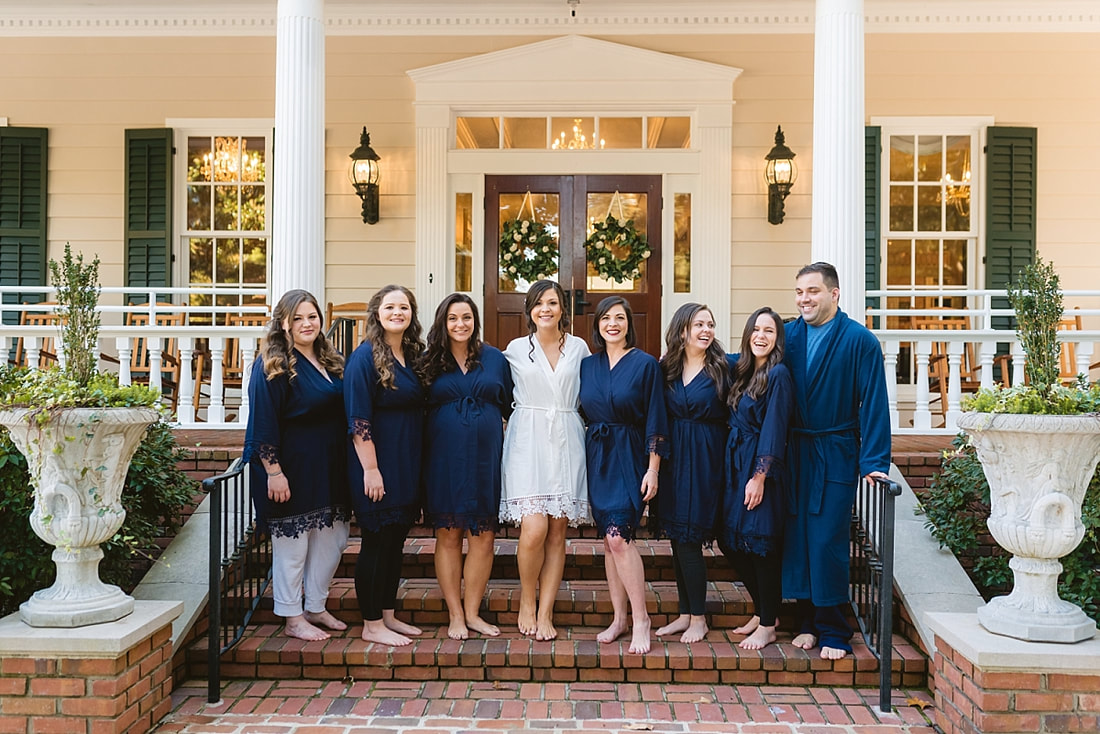 bride with her bridesmaid on the steps at Orion Hill in Arlington, TN