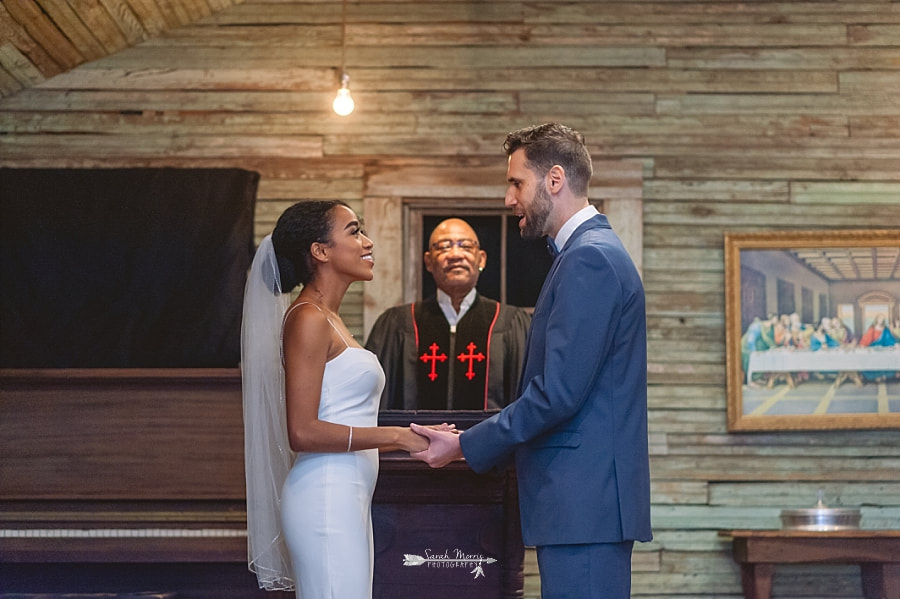 Bride and Groom getting married in the old country church exhibit at the Stax Museum