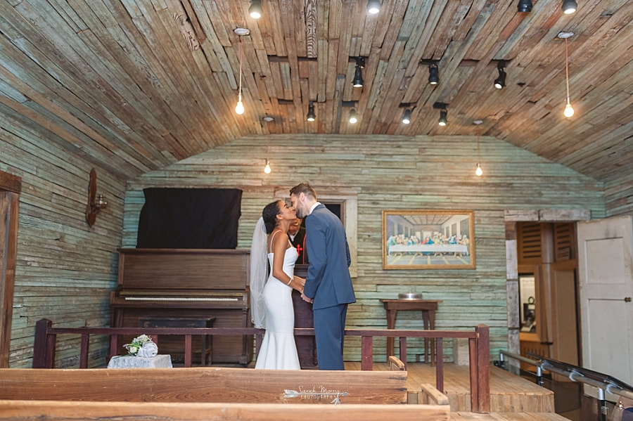 PBride and Groom getting married in the old country church exhibit at the Stax Museum