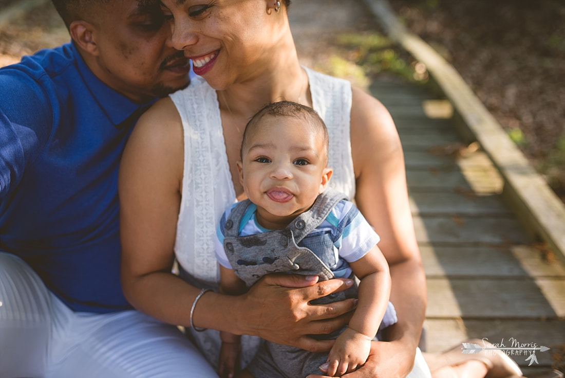 Close up of baby in family pictures of walking bridge at Shelby Farms Park